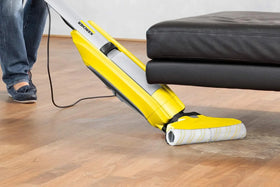 Kärcher FC 5 yellow hard floor cleaner with microfibre rollers in use