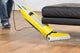 Kärcher FC 5 yellow hard floor cleaner with microfibre rollers in use